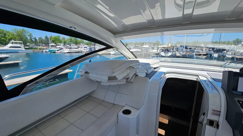  Yacht Photos Pics 2017 Cruisers Yachts 390 Express Coupe interior view at marina.