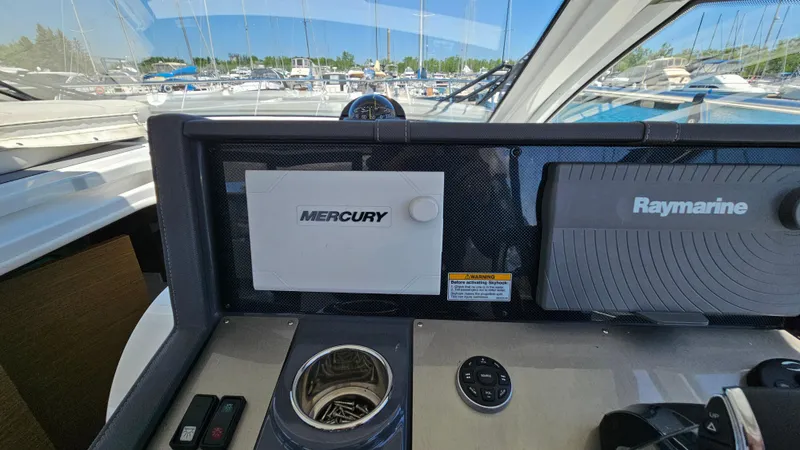  Yacht Photos Pics Control panel of 2017 Cruisers Yachts 390 Express Coupe with Mercury and Raymarine systems.