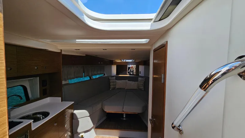  Yacht Photos Pics Interior of 2017 Cruisers Yachts 390 Express Coupe, featuring modern design and skylight.