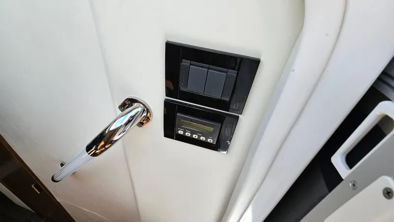  Yacht Photos Pics 2017 Cruisers Yachts 390 Express Coupe interior door handle and control panel.