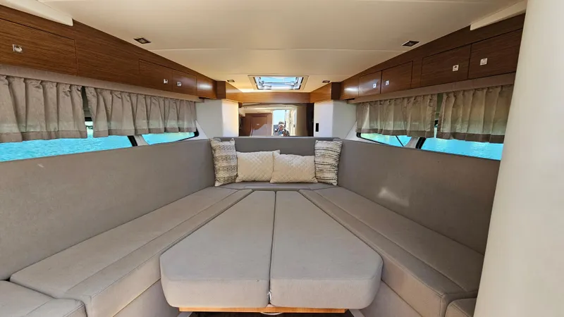  Yacht Photos Pics 2017 Cruisers Yachts 390 Express Coupe interior with spacious seating and elegant design.