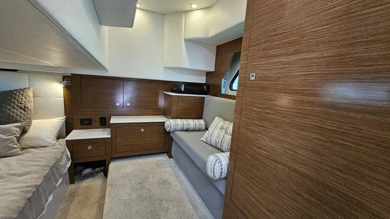  Yacht Photos Pics 2017 Cruisers Yachts 390 Express Coupe interior with modern wood finish and cozy seating.