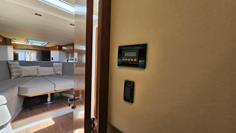  Yacht Photos Pics Interior of 2017 Cruisers Yachts 390 Express Coupe, featuring a cozy seating area.