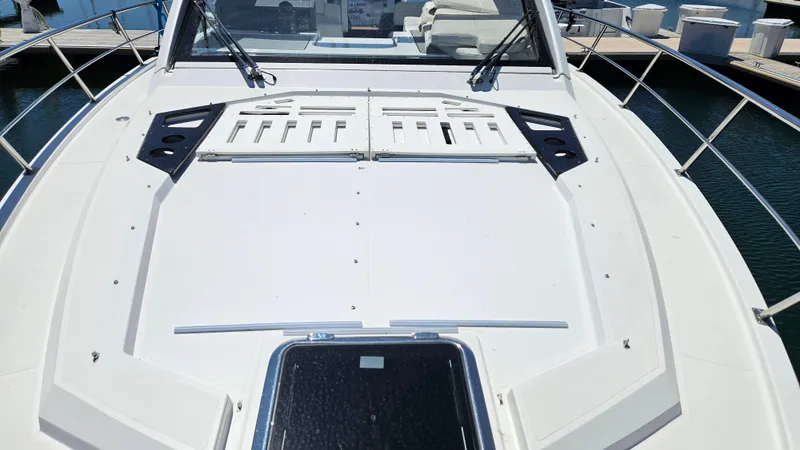  Yacht Photos Pics 2017 Cruisers Yachts 390 Express Coupe, sleek deck view at marina.