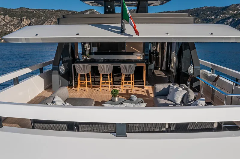 X96 Triplex Yacht Photos Pics Luxury deck of Extra X96 TRIPLEX yacht, 2025 model, with seating and bar area.