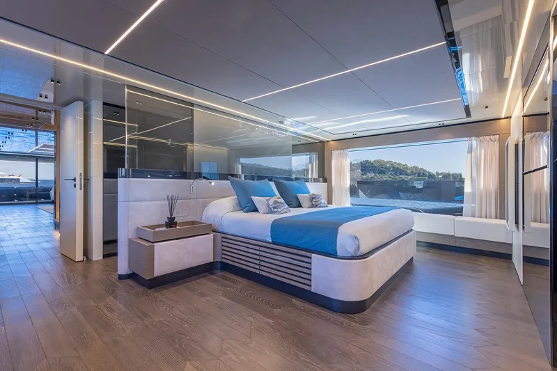 X96 Triplex Yacht Photos Pics Luxurious bedroom interior of the 2025 Extra X96 TRIPLEX yacht with scenic ocean view.