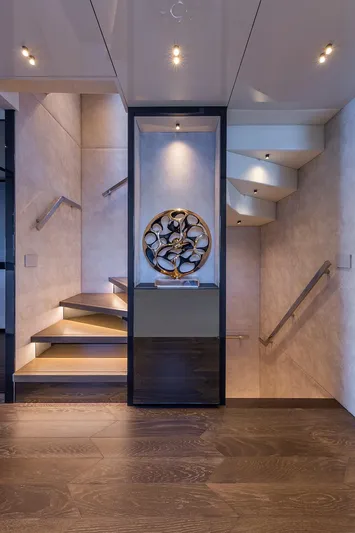 X96 Triplex Yacht Photos Pics Modern staircase with artistic decor in Extra X96 TRIPLEX yacht, 2025 model.