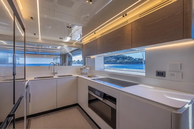 X96 Triplex Yacht Photos Pics Modern kitchen interior on the 2025 Extra X96 TRIPLEX yacht with ocean view.