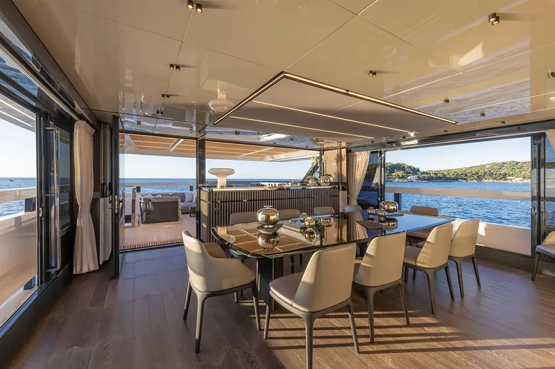 X96 Triplex Yacht Photos Pics Luxurious dining area on the 2025 Extra X96 TRIPLEX yacht with ocean view.