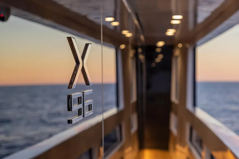 X96 Triplex Yacht Photos Pics 2025 Extra X96 TRIPLEX yacht interior with ocean view at sunset.