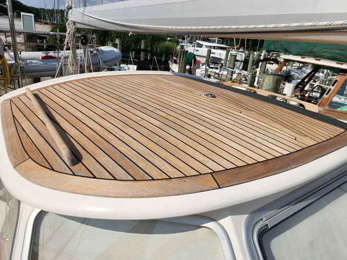 Bella Rose Yacht Photos Pics Teak deck of 2006 Hallberg-Rassy 48 sailboat, showcasing elegant craftsmanship.
