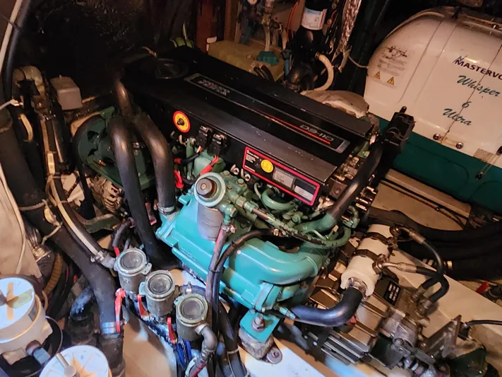 Bella Rose Yacht Photos Pics Engine room of a 2006 Hallberg-Rassy 48 yacht, featuring a detailed view of the engine.