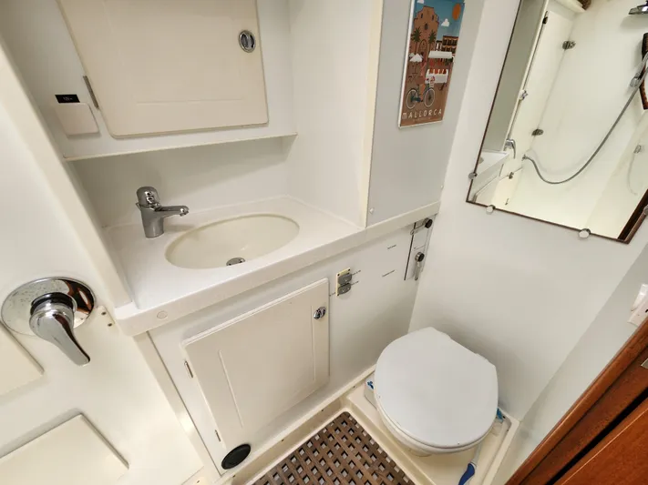 Bella Rose Yacht Photos Pics Bathroom interior of 2006 Hallberg-Rassy 48 yacht, featuring sink and toilet.