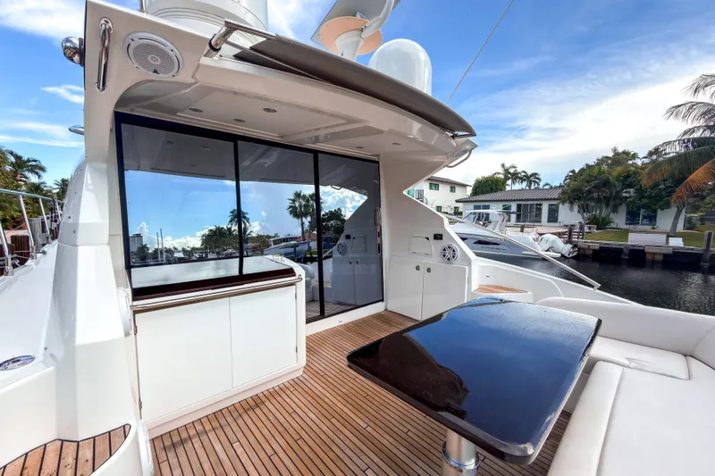  Yacht Photos Pics 2015 Beneteau Gran Turismo 49 yacht deck with sleek design and waterfront view.