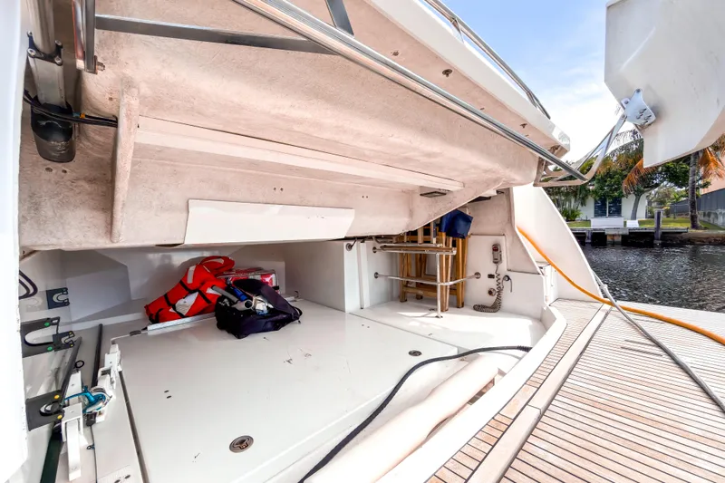  Yacht Photos Pics 2015 Beneteau Gran Turismo 49 yacht storage area with life jackets and equipment.