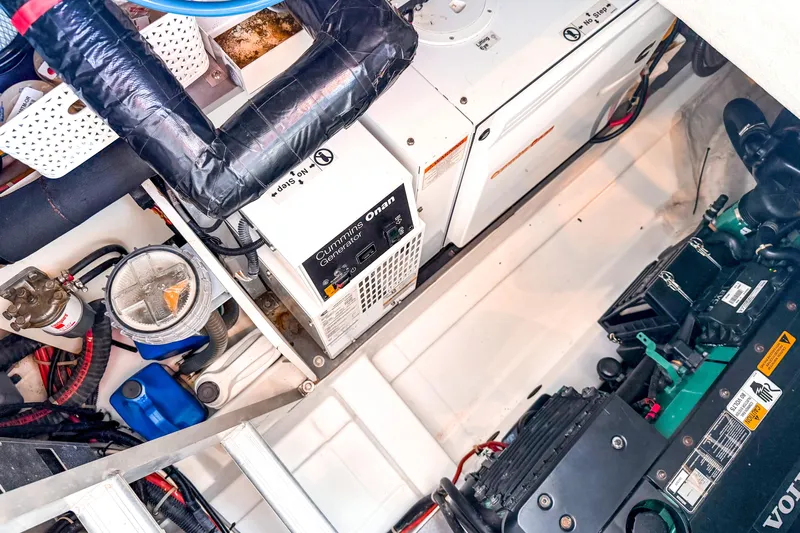  Yacht Photos Pics Engine room of 2015 Beneteau Gran Turismo 49 with Cummins Onan generator and Volvo engine.