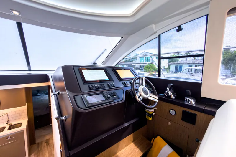  Yacht Photos Pics Helm station of 2015 Beneteau Gran Turismo 49 yacht, featuring modern controls and navigation systems.