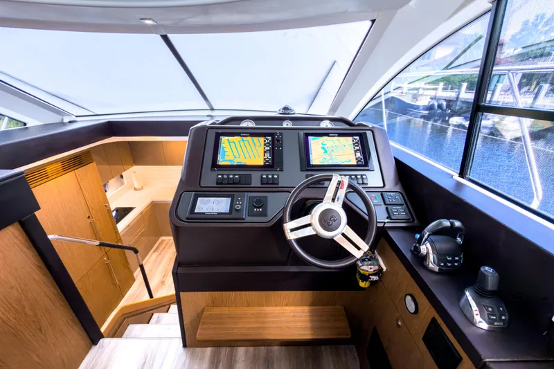  Yacht Photos Pics 2015 Beneteau Gran Turismo 49 yacht helm with modern navigation systems and luxurious interior.