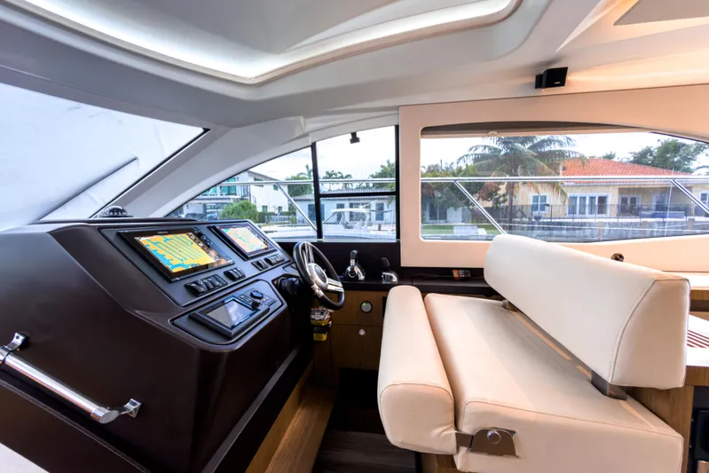  Yacht Photos Pics Interior helm of 2015 Beneteau Gran Turismo 49 yacht with modern navigation displays.