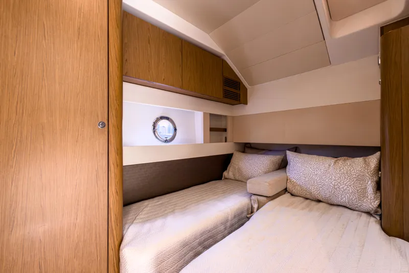  Yacht Photos Pics Luxurious cabin interior of 2015 Beneteau Gran Turismo 49 yacht with twin beds.