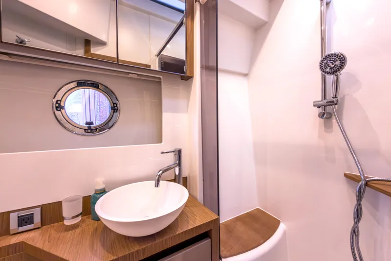  Yacht Photos Pics Luxurious bathroom in 2015 Beneteau Gran Turismo 49 yacht with modern fixtures.