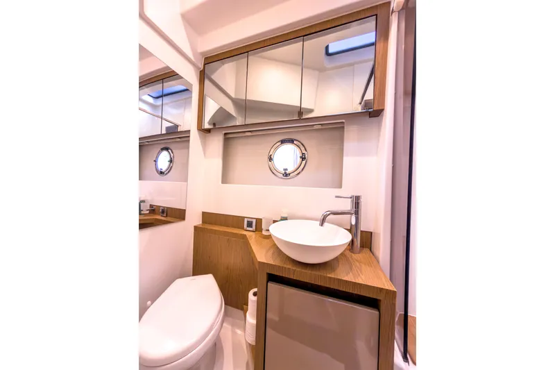  Yacht Photos Pics Luxurious bathroom in 2015 Beneteau Gran Turismo 49 yacht with modern fixtures.