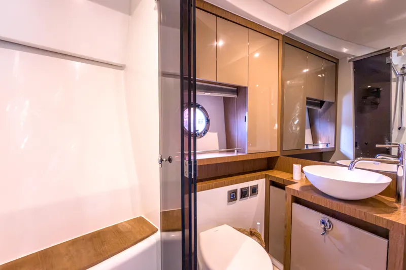  Yacht Photos Pics Luxurious bathroom in 2015 Beneteau Gran Turismo 49 yacht, featuring modern fixtures and elegant design.