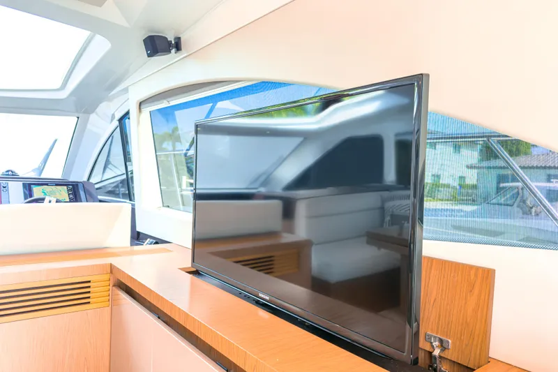  Yacht Photos Pics Interior of 2015 Beneteau Gran Turismo 49 yacht with modern TV and navigation system.