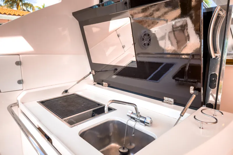  Yacht Photos Pics 2015 Beneteau Gran Turismo 49 yacht kitchen with sink and grill.