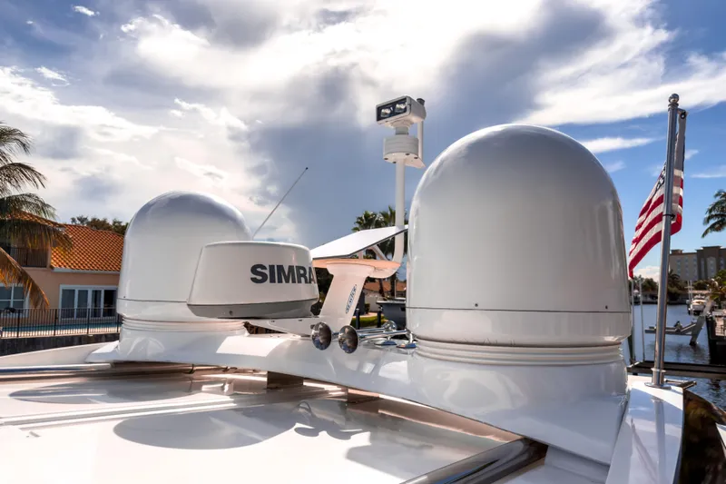  Yacht Photos Pics Radar equipment on 2015 Beneteau Gran Turismo 49 yacht under a partly cloudy sky.