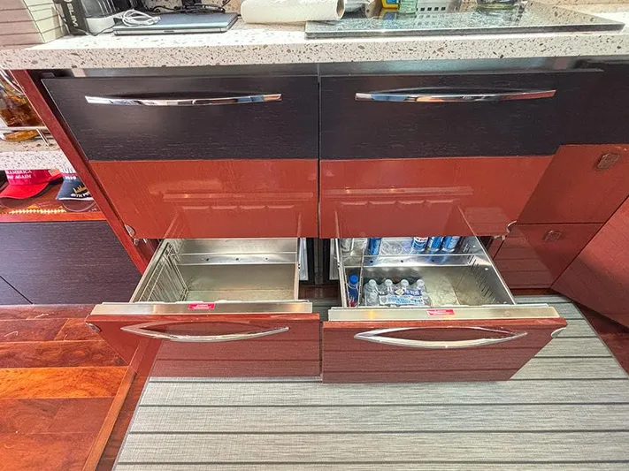  Yacht Photos Pics Modern kitchen drawers in 2017 Sea Ray L590 yacht, featuring sleek design and ample storage.