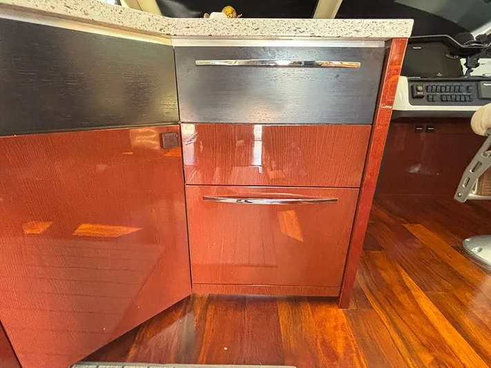  Yacht Photos Pics 2017 Sea Ray L590 yacht interior with sleek wooden cabinetry and polished flooring.