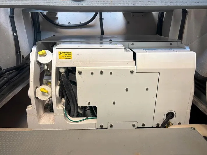  Yacht Photos Pics Engine compartment of a 2017 Sea Ray L590 yacht, showcasing mechanical components.