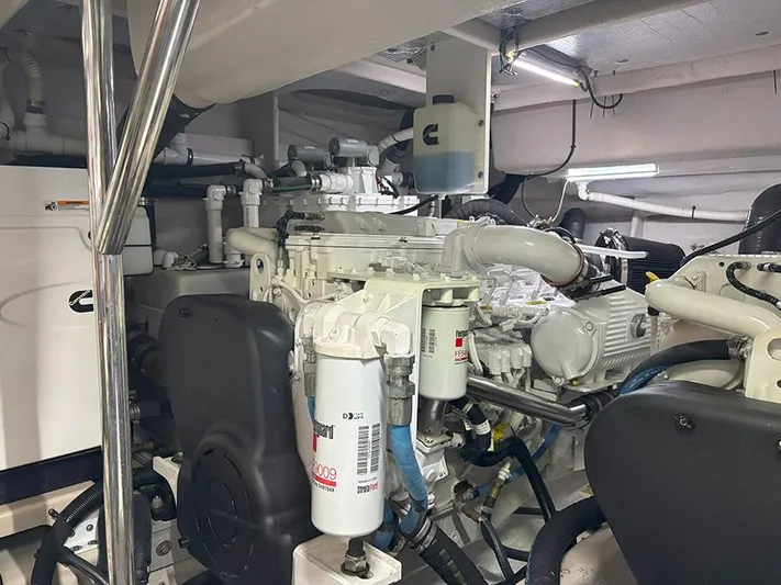  Yacht Photos Pics Engine room of a 2017 Sea Ray L590 yacht, showcasing mechanical components and systems.