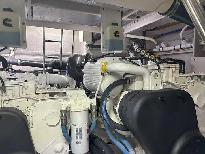  Yacht Photos Pics Engine room of 2017 Sea Ray L590 yacht, showcasing complex machinery and piping.