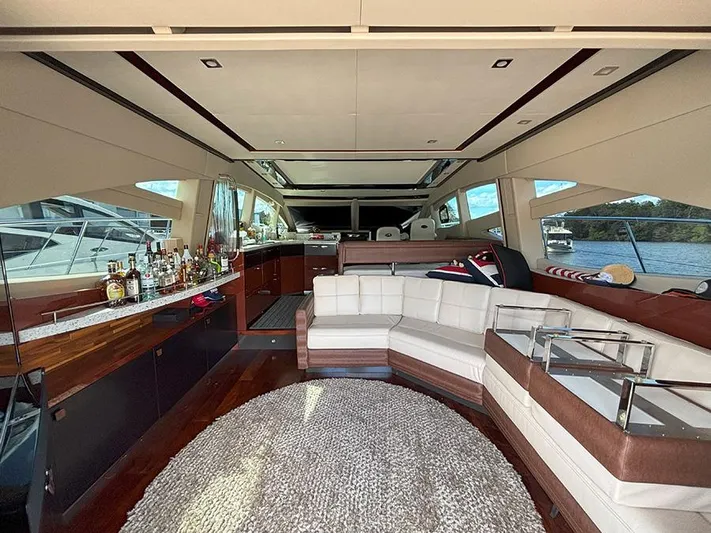  Yacht Photos Pics Luxurious interior of a 2017 Sea Ray L590 yacht with elegant seating and bar area.
