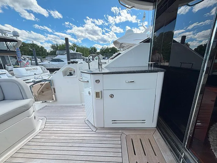  Yacht Photos Pics 2017 Sea Ray L590 yacht deck with outdoor kitchenette and seating area.