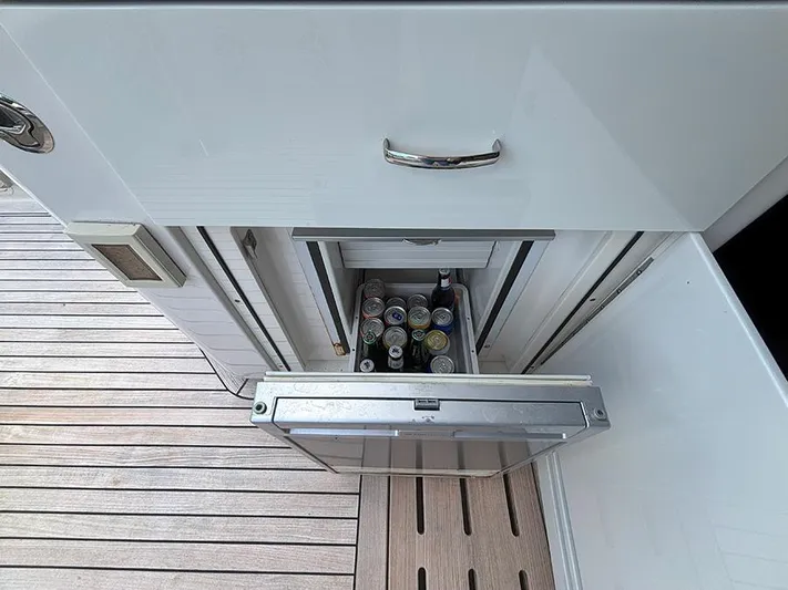  Yacht Photos Pics Built-in mini fridge on 2017 Sea Ray L590 yacht, stocked with beverages.