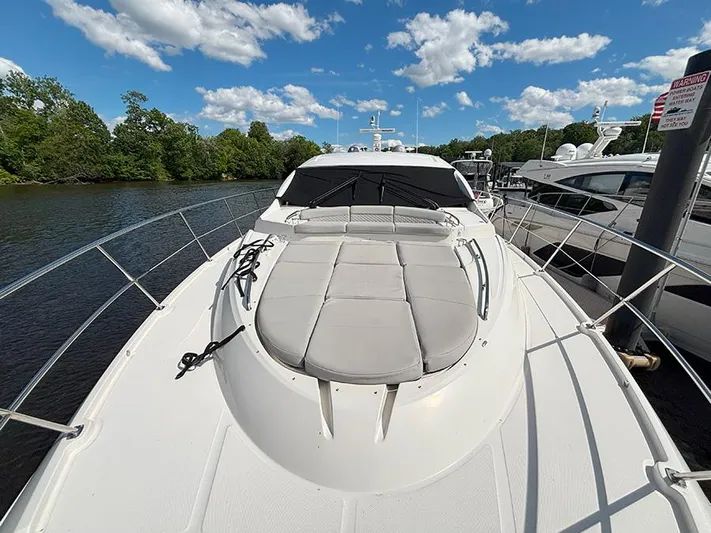  Yacht Photos Pics 2017 Sea Ray L590 yacht on a sunny day, docked by a serene river.