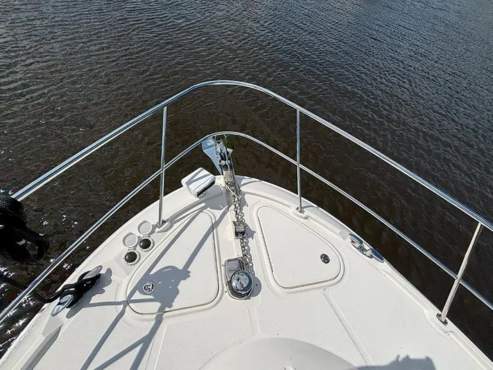  Yacht Photos Pics 2017 Sea Ray L590 yacht bow with railing, anchor, and calm water view.