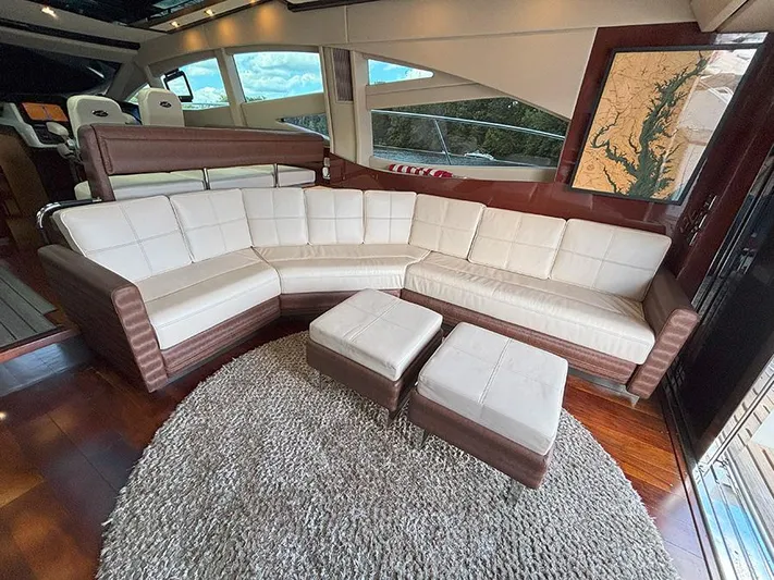  Yacht Photos Pics Luxurious interior of 2017 Sea Ray L590 yacht with plush seating and elegant decor.