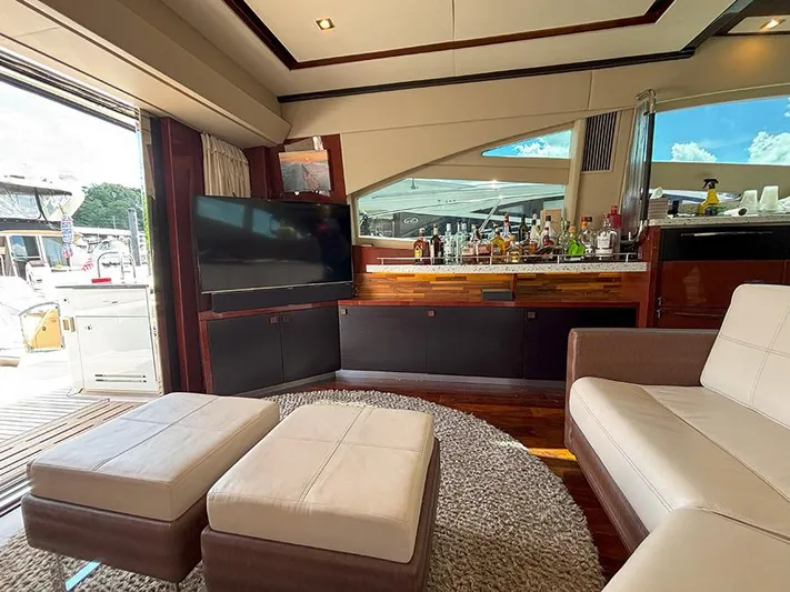  Yacht Photos Pics Luxurious interior of 2017 Sea Ray L590 yacht with modern seating and entertainment area.