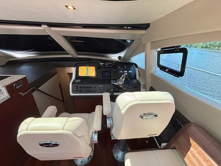  Yacht Photos Pics Interior of 2017 Sea Ray L590 yacht cockpit with modern navigation equipment.
