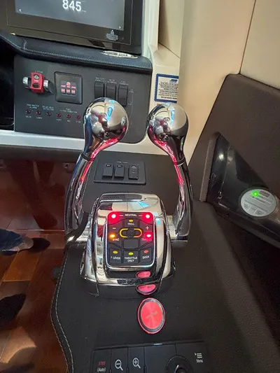  Yacht Photos Pics Control panel of a 2017 Sea Ray L590 yacht with dual throttle levers.