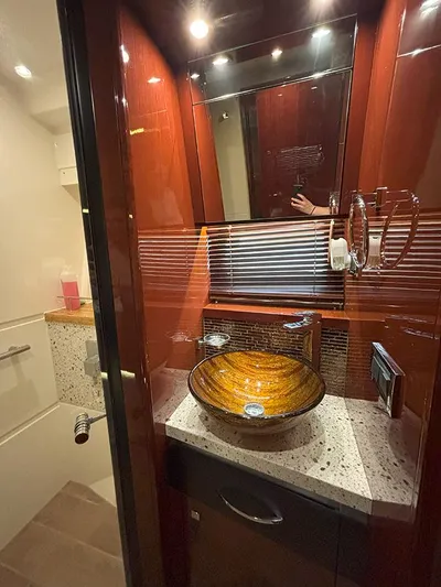 Yacht Photos Pics Luxurious bathroom in 2017 Sea Ray L590 yacht with elegant vessel sink and modern fixtures.