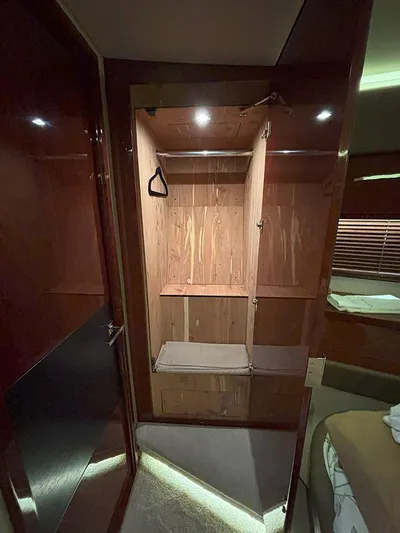  Yacht Photos Pics 2017 Sea Ray L590 yacht interior closet with wooden finish and lighting.