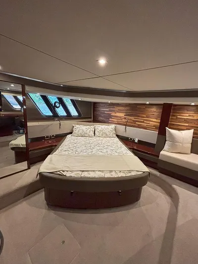  Yacht Photos Pics Luxurious interior of 2017 Sea Ray L590 yacht with elegant bed and seating area.