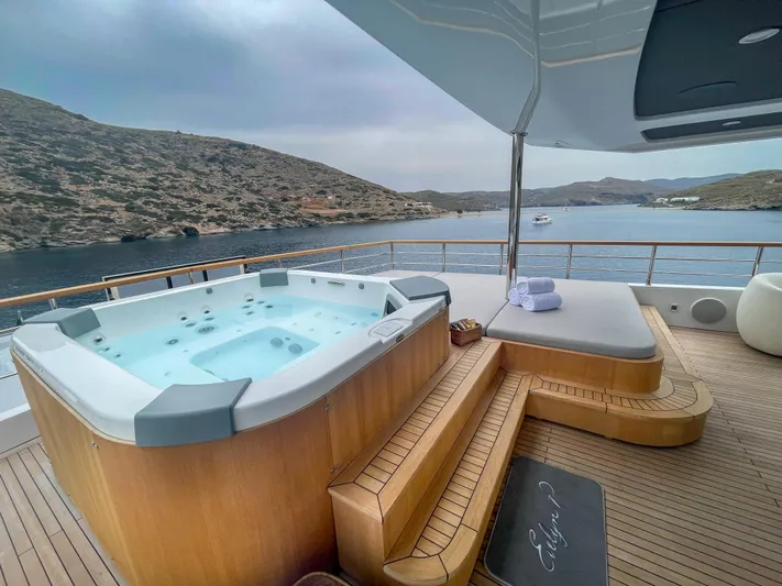 Evelyn P Yacht Photos Pics Luxurious 2022 Numarine 37XP yacht deck with hot tub and scenic ocean view.