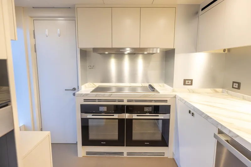 Evelyn P Yacht Photos Pics Modern kitchen in 2022 Numarine 37XP yacht with dual ovens and sleek cabinetry.