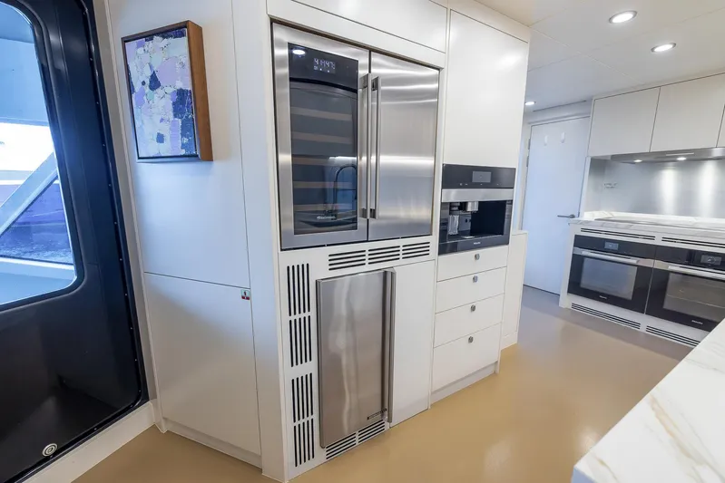 Evelyn P Yacht Photos Pics Modern kitchen interior on 2022 Numarine 37XP yacht with stainless steel appliances.